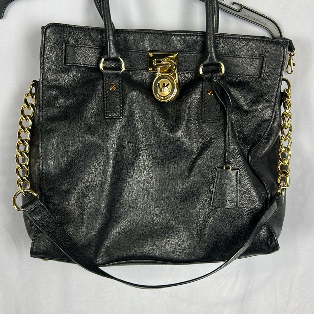 Michael Kors black purse with lock and key